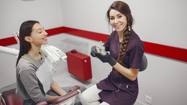 doctor with patient in a dental office